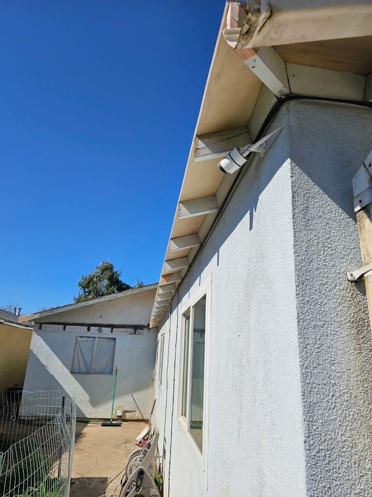 Finished, painted eaves and rafter tails after dry rot repair