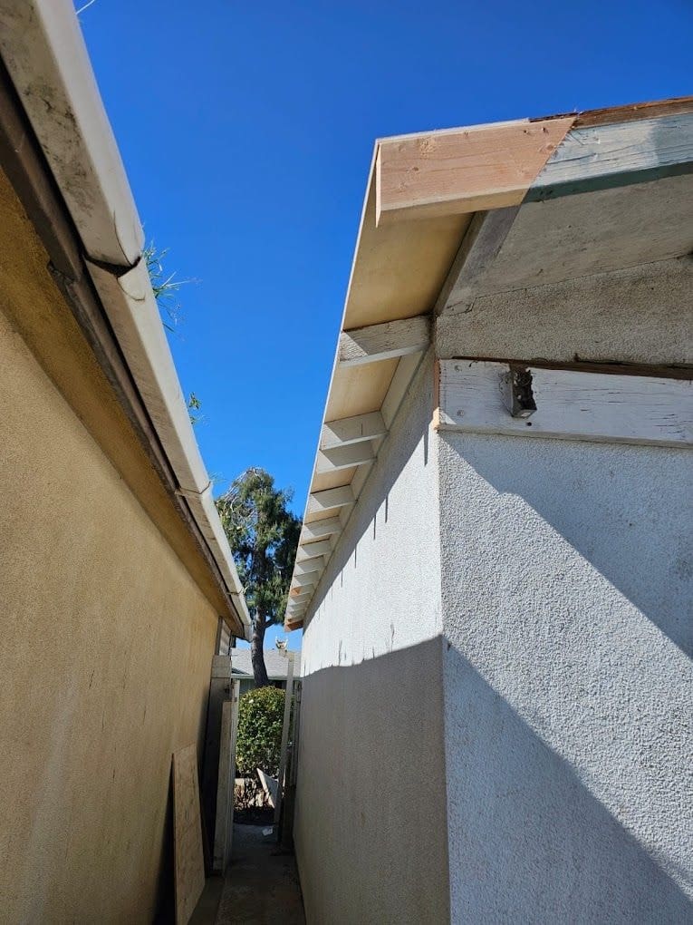 Damaged eave and missing fascia before dry rot repair