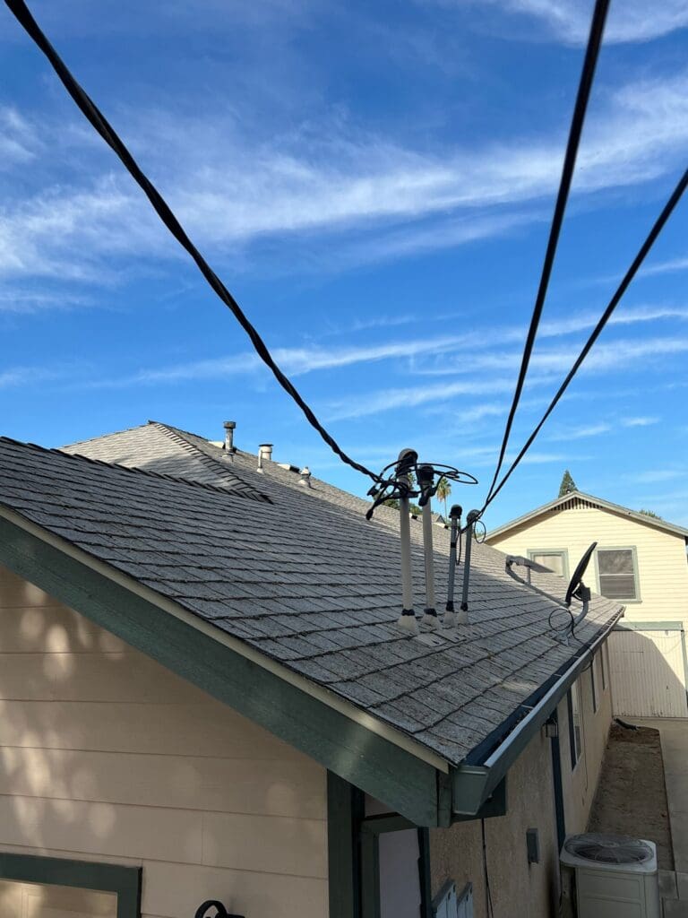 Re-sealed pipe penetrations on a shingle roof