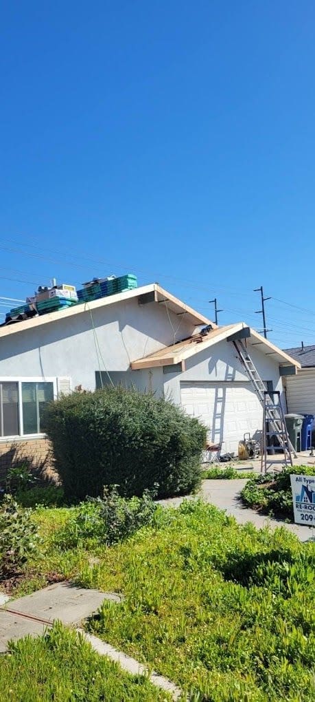 Re-roof underway on a single-story home
